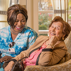 resident with a staff member