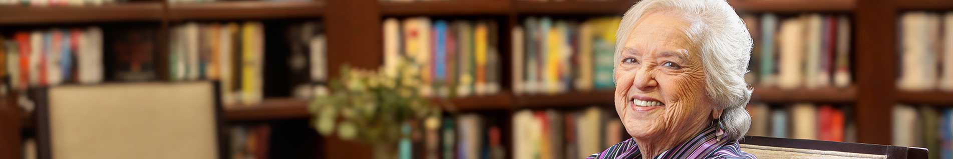 resident reading in a library