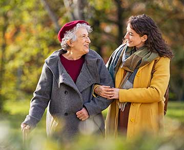 staff member on a walk outside with a resident